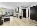 Bright living room featuring a fireplace and hardwood floors at 13950 E Oxford Pl # A115, Aurora, CO 80014