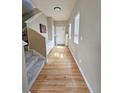 Bright entry hallway with hardwood floors, leading to the home's main living spaces at 23831 Eagle Bend Ln, Parker, CO 80138