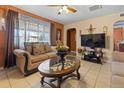 Cozy living room featuring tile floors, and neutral walls, perfect for relaxation at 9410 Cedar Ct, Thornton, CO 80229