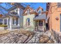 Quaint Victorian home featuring a cozy front porch and a well-maintained facade at 2543 Stout St, Denver, CO 80205