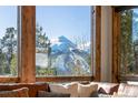 Spectacular mountain views from expansive windows at 1259 Baldy Rd, Breckenridge, CO 80424