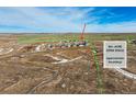 Aerial view showcasing the community's location near 86+ acre open space with marked boundaries at 42976 Colonial Trl, Elizabeth, CO 80107