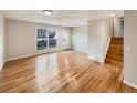 Hardwood floors and large windows in living room at 10968 Grange Creek Dr, Thornton, CO 80233