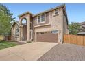 Beautiful two story home with arched entryway and large garage at 16519 E Hialeah Dr, Centennial, CO 80015