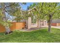 A well-maintained lawn and brick exterior highlight the charm of this inviting home at 16519 E Hialeah Dr, Centennial, CO 80015