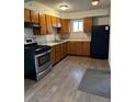 Functional kitchen with modern appliances, ample cabinet space, and a view out the window at 945 Zenobia St, Denver, CO 80204