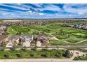 Gorgeous aerial view of house on golf course in a quiet neighborhood at 7658 S Country Club Pkwy, Aurora, CO 80016