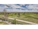 Scenic view of sprawling golf course with walking path at 7658 S Country Club Pkwy, Aurora, CO 80016