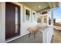 Cozy front porch with seating, perfect for relaxing and enjoying the neighborhood views at 5936 N Lisbon St, Aurora, CO 80019