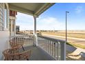 Inviting porch with chairs and a lovely view at 5936 N Lisbon St, Aurora, CO 80019