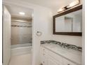 Clean bathroom with modern vanity, framed mirror and tiled shower at 800 N Pearl St # 611, Denver, CO 80203