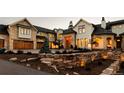 Elegant home with stone accents, multiple garages, and gated entry at 9356 Cherrywood Trl, Littleton, CO 80127