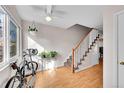 Inviting entryway with hardwood floors, a staircase, ample natural light, and indoor plants at 9925 W 20Th Ave # 17, Lakewood, CO 80215