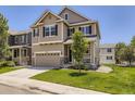 Charming two-story home with a well-manicured lawn, attached two car garage, and inviting front porch at 3508 E 140Th Pl, Thornton, CO 80602