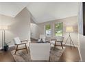 Bright living room with modern furniture, hardwood floors, and large windows offering ample natural light at 1285 Aberdeen Dr, Broomfield, CO 80020