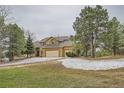 Charming two-story home with attached three-car garage and mature trees in a desirable location at 19375 Sherwood Trl, Monument, CO 80132