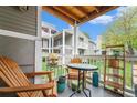 Cozy outdoor balcony with chairs and small table, perfect for relaxing outdoors at 4460 S Pitkin St # 119, Aurora, CO 80015