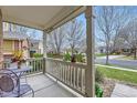 Inviting front porch with a table and chairs, perfect for relaxing outdoors at 14245 Corrine Ct, Broomfield, CO 80023