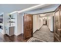 Inviting hallway with wood floors, modern lighting, and stylish decor leading to unit 1901 at 1551 Larimer St # 1901, Denver, CO 80202