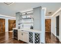 Entertainer's wet bar includes wine storage, custom cabinetry, and stylish design at 1551 Larimer St # 1901, Denver, CO 80202