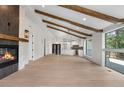 Inviting living room featuring vaulted ceilings, exposed beams, and a seamless transition to the modern kitchen at 2665 Juilliard St, Boulder, CO 80305
