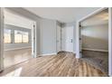 Spacious foyer featuring hardwood floors and neutral paint at 868 S Reed Ct # H, Lakewood, CO 80226