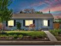 Charming single-story home with green lawn and garden under a bright sky with hints of pink at dusk at 4740 W Wyoming Pl, Denver, CO 80219