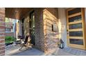 Inviting front porch with brick accents and cozy seating area at 501 S Race St, Denver, CO 80209