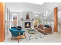 Bright living room featuring a fireplace, modern staircase, and stylish furnishings at 501 S Race St, Denver, CO 80209