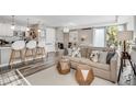 Bright living room featuring modern decor, including a comfortable sofa and stylish accent tables at 1150 Vine St # 201, Denver, CO 80206