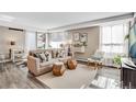 Cozy living room with modern sofa, geometric side tables, and sunlit windows at 1150 Vine St # 201, Denver, CO 80206
