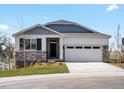 Charming single-Gathering home with a well-manicured lawn, two-car garage, and stone detailing at 1975 S Coolidge Way, Aurora, CO 80018