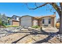 Single-Gathering home with a two-car garage, tidy yard, and inviting front entrance at 9655 W 105Th Way, Broomfield, CO 80021