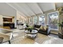 Open living room with a view into the kitchen and dining area at 10674 E Powers Dr, Englewood, CO 80111