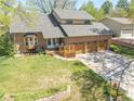 Beautiful home with a well-kept lawn, mature trees, and a spacious three-car garage at 128 Baylor Dr, Longmont, CO 80503