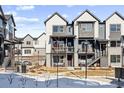 Modern two-story townhome with gray and white exterior at 12387 W 51St Ave, Wheat Ridge, CO 80033