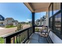 Inviting front porch with chairs; ideal for relaxation with a view of the neighborhood at 39167 Braxton Ln, Elizabeth, CO 80107