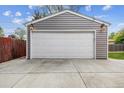 Close-up of detached garage with a white door, providing secure parking at 7192 W 67Th Pl, Arvada, CO 80003