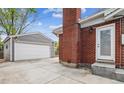 Detached two-car garage with painted siding, offering ample parking and storage space at 7192 W 67Th Pl, Arvada, CO 80003
