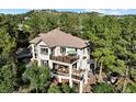 Luxury home with expansive deck and private wooded setting at 918 Dakota Dr, Castle Rock, CO 80108