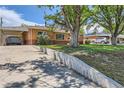 The property boasts a convenient carport and a well-maintained lawn at 9221 High St, Thornton, CO 80229