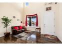 Bright and airy foyer boasts hardwood floors and a soaring two-story ceiling at 11460 W Tanforan Cir, Littleton, CO 80127