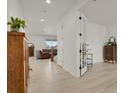 Bright and airy living room featuring hardwood floors, and view of the staircase at 7325 S Waterloo Way, Aurora, CO 80016