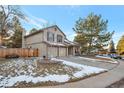 Exterior showcasing well-maintained lawn, mature trees, and partial driveway at 170 Dover Ct, Castle Pines, CO 80108