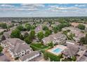 Aerial view of the residential community showcasing well-maintained landscaping, pool, and surrounding neighborhood at 8707 E Florida Ave # 614, Denver, CO 80247