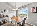 Charming dining area with a view, perfect for enjoying meals and entertaining guests at 1425 Blue Sky Cir # 15-301, Erie, CO 80516
