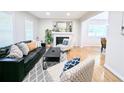 Bright living room with modern fireplace and comfortable seating at 1054 Magnolia St, Denver, CO 80220