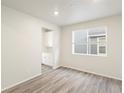 Dining area with a window and view to an adjacent kitchen at 6156 Hourglass Dr, Brighton, CO 80601