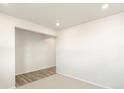 Empty spare bedroom with neutral walls and wood-look flooring at 6156 Hourglass Dr, Brighton, CO 80601