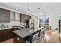 Spacious kitchen featuring modern cabinetry, stainless steel appliances, and an island at 903 E 13Th Ave, Denver, CO 80218